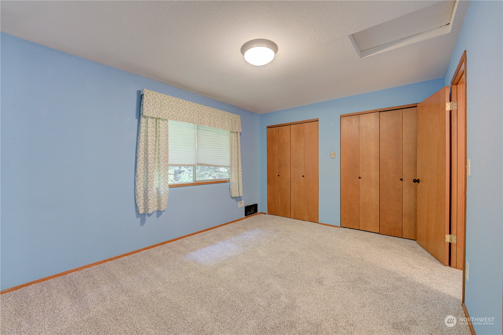 18910 Bothell Everett Highway, Unit J3 Bothell, WA 98012 - Photo 24 of 33 a view of an empty room with a window