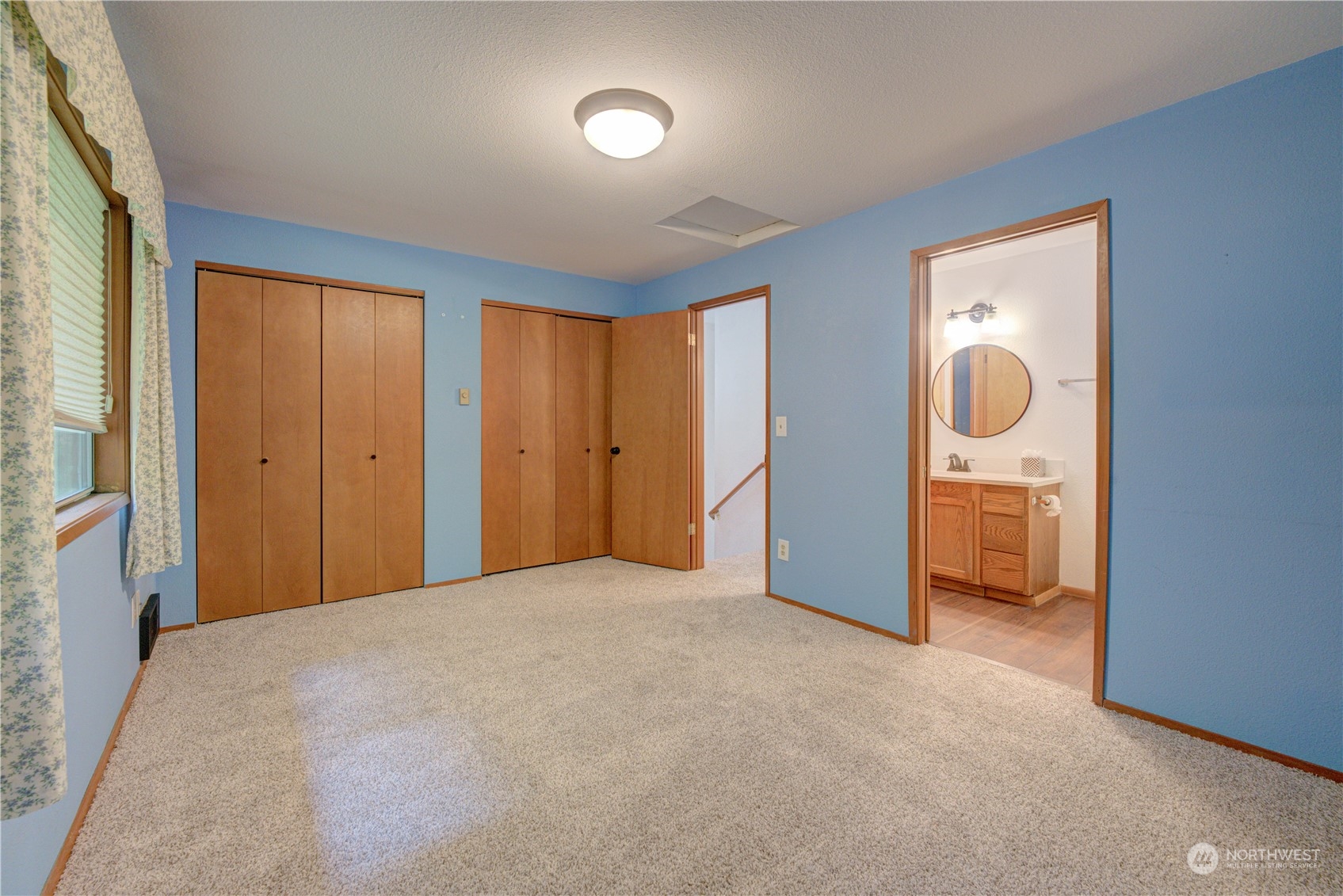 18910 Bothell Everett Highway, Unit J3 Bothell, WA 98012 - Photo 25 of 33 a view of an empty room with a fireplace