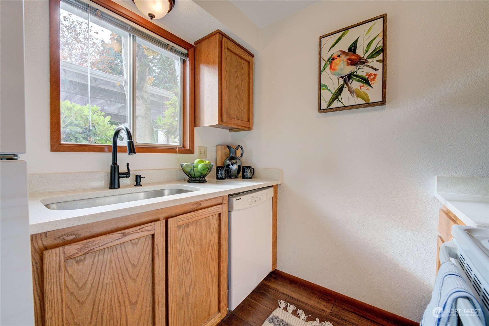 18910 Bothell Everett Highway, Unit J3 Bothell, WA 98012 - Photo 7 of 33 a hallway with a sink and a window