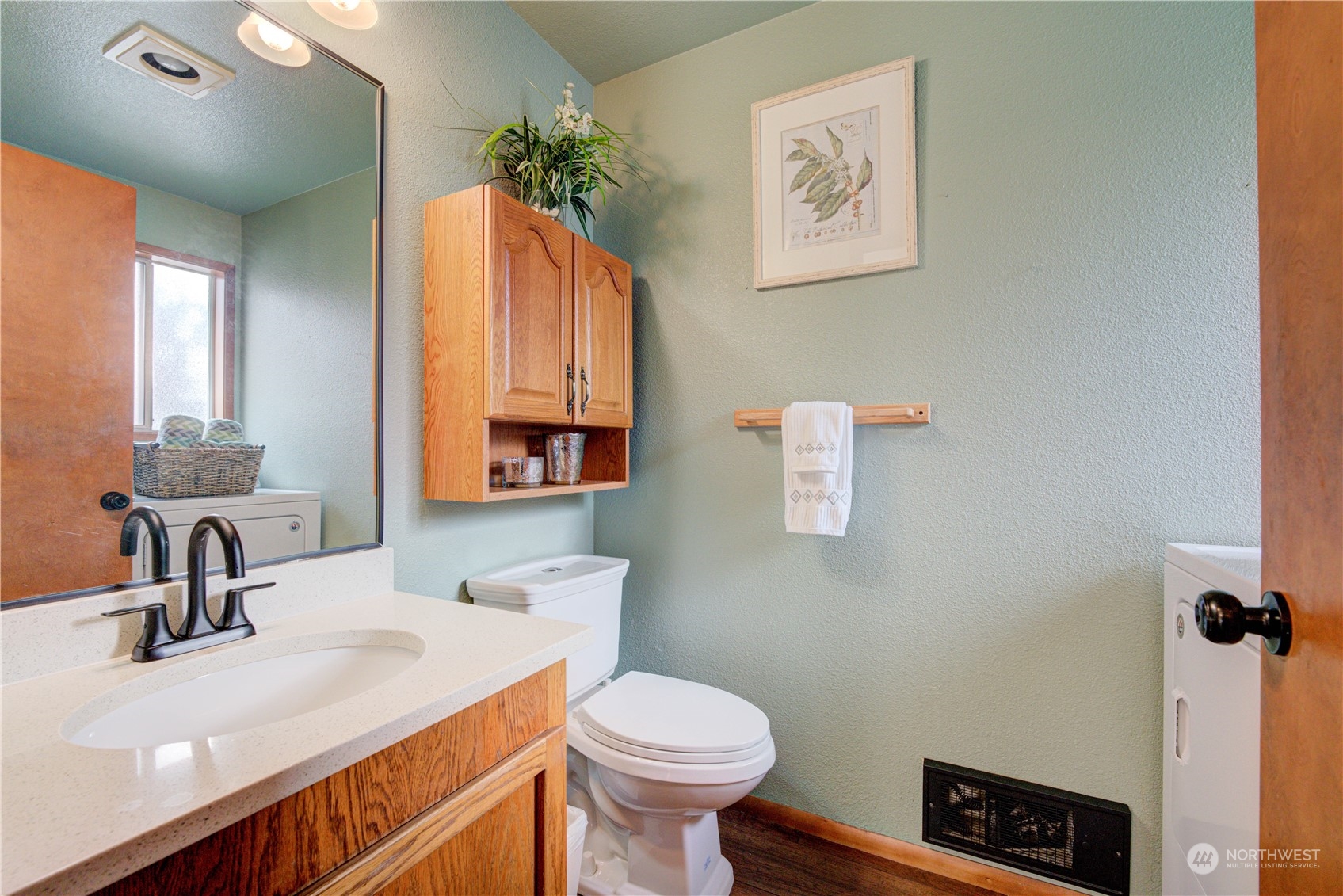 18910 Bothell Everett Highway, Unit J3 Bothell, WA 98012 - Photo 9 of 33 a bathroom with a sink toilet and a mirror