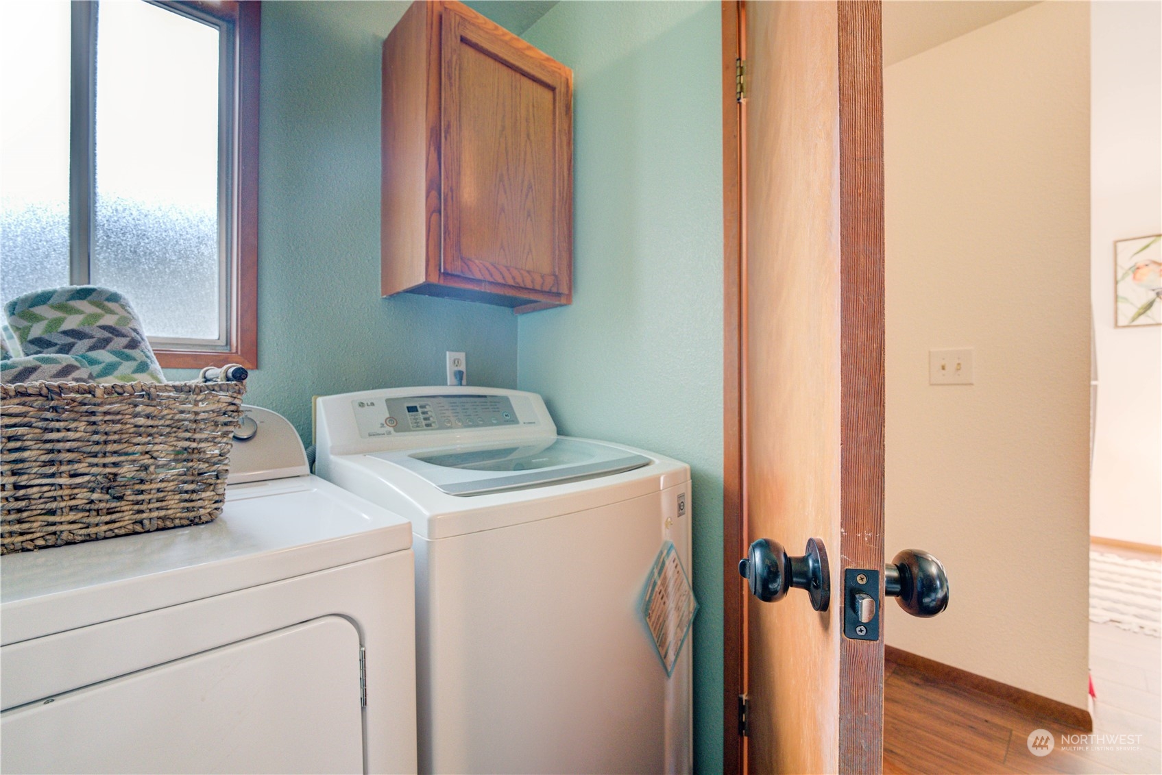 18910 Bothell Everett Highway, Unit J3 Bothell, WA 98012 - Photo 10 of 33 a utility room with dryer and washer