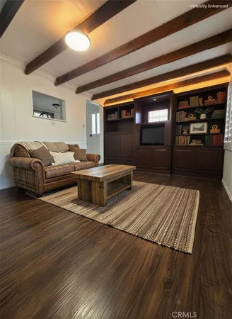 a bedroom with furniture and wooden floor