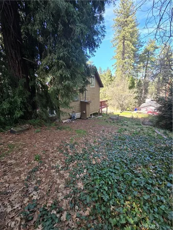 a view of a house with a tree in the background