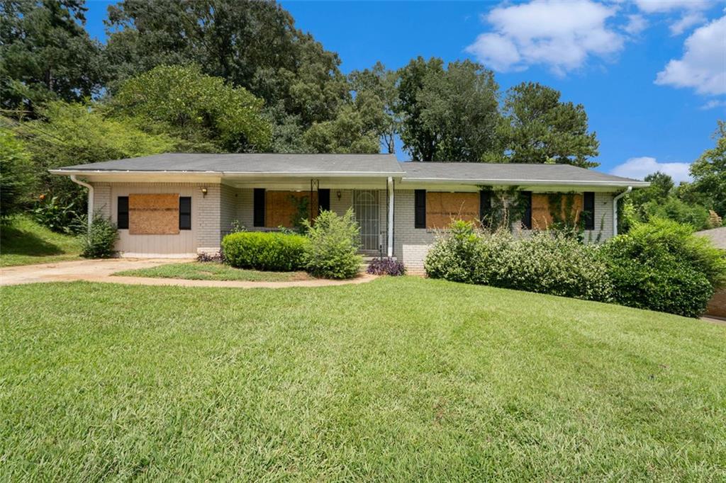 front view of a house with a yard