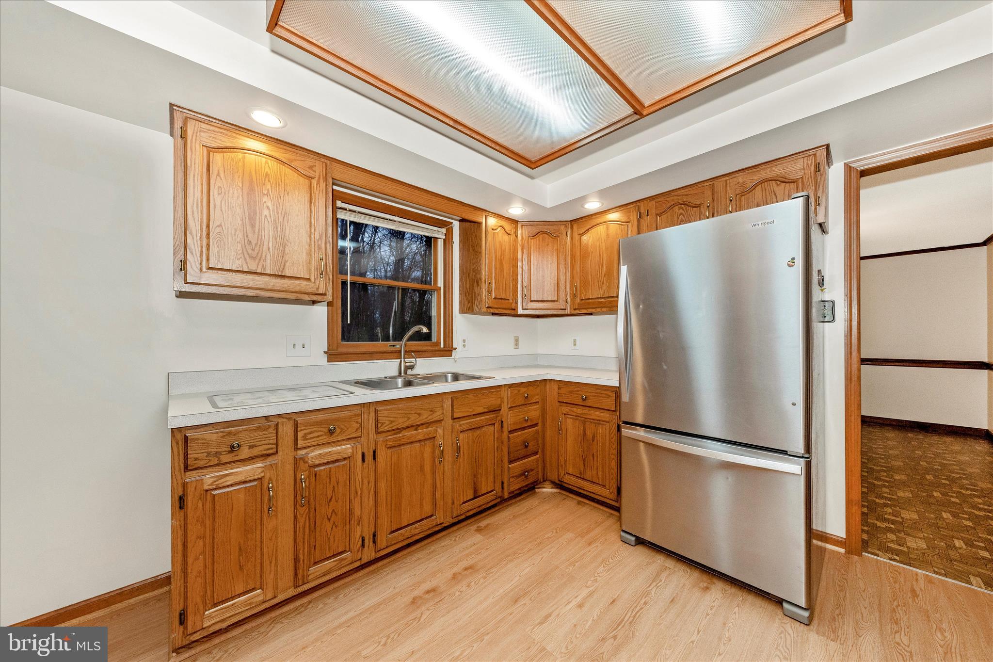 24607 Hells Delight Road Smithsburg, MD 21783 - Photo 13 of 47 a kitchen with stainless steel appliances granite countertop a refrigerator a sink and a stove