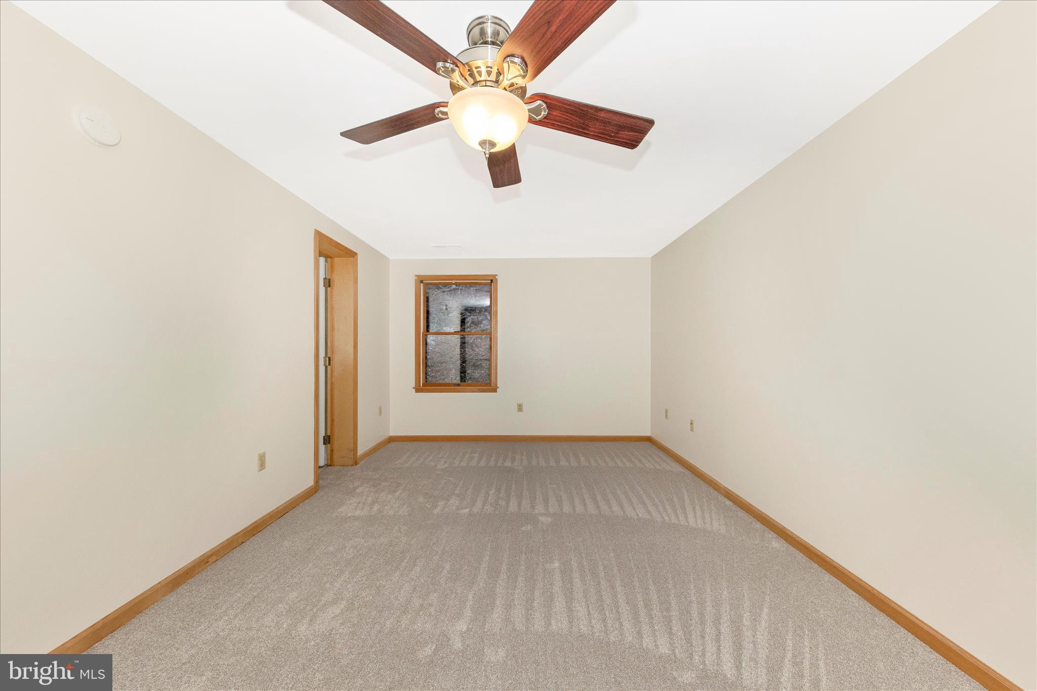 24607 Hells Delight Road Smithsburg, MD 21783 - Photo 19 of 47 an empty room with windows and fan