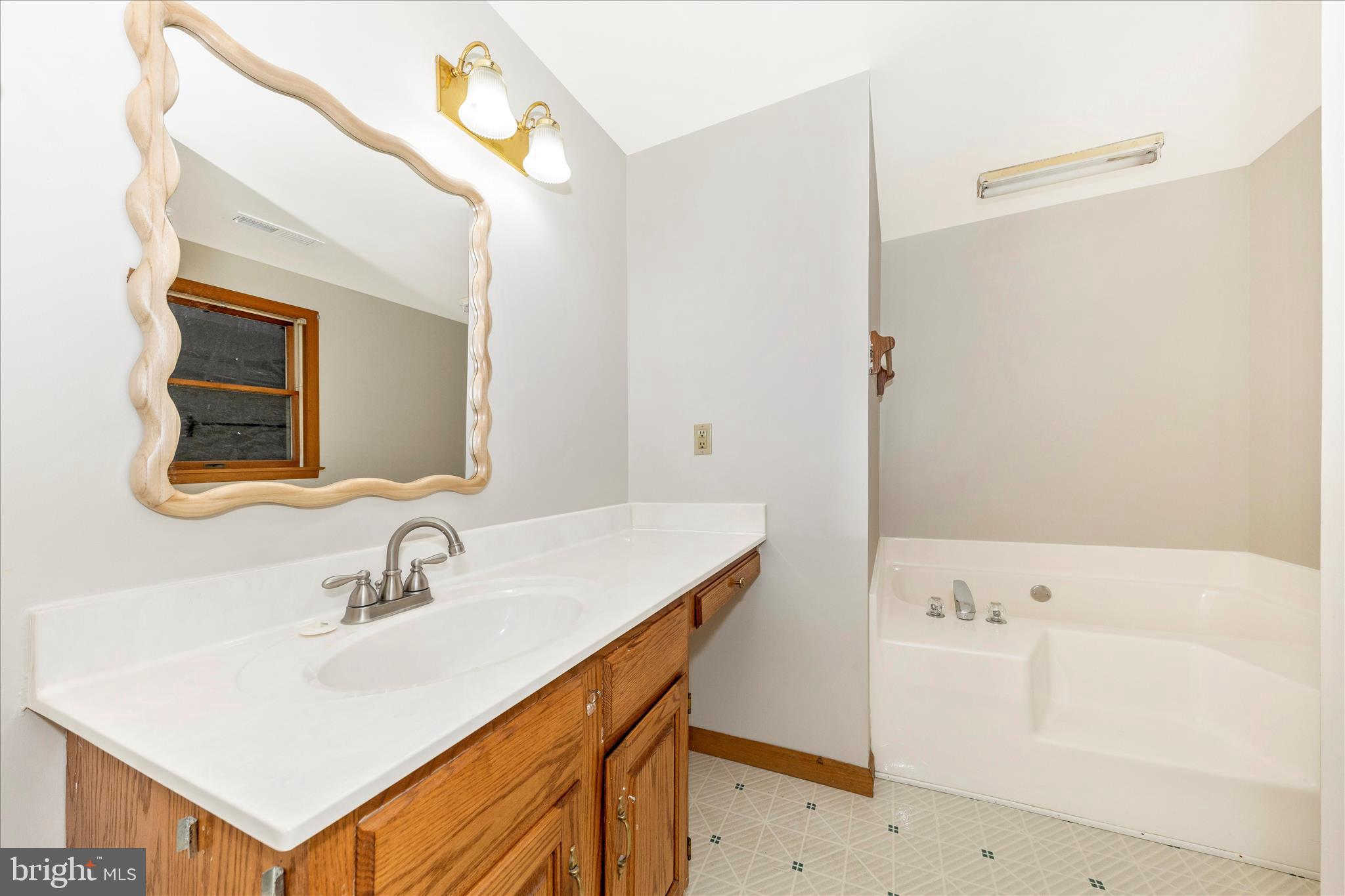 24607 Hells Delight Road Smithsburg, MD 21783 - Photo 22 of 47 a bathroom with a sink and a mirror