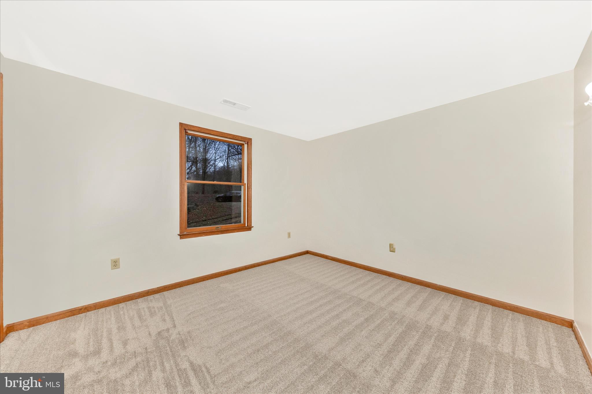 24607 Hells Delight Road Smithsburg, MD 21783 - Photo 24 of 47 a view of an empty room and window