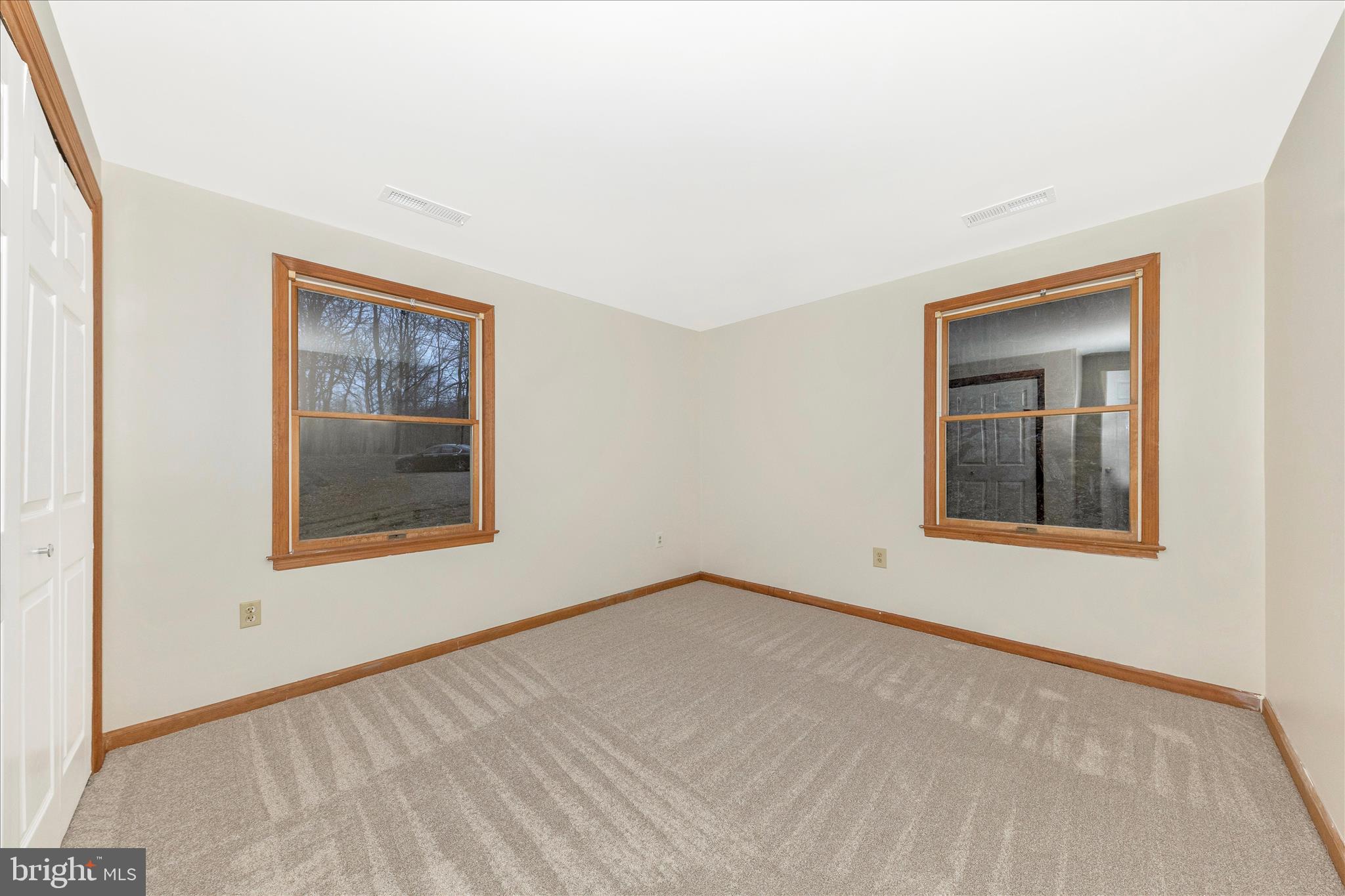24607 Hells Delight Road Smithsburg, MD 21783 - Photo 28 of 47 a view of an empty room with window and closet
