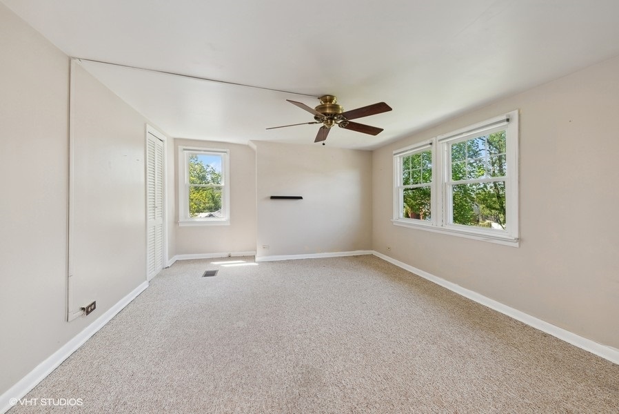 605 Revere Road Glenview, IL 60025 - Photo 8 of 18 a view of an empty room with a window