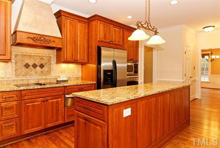 10813 Cahill Road Raleigh, NC 27614 - Photo 8 of 25 The kitchen is newly renovated and offers granite countertops, stainless steel appliances and refinished wood floors! Kitchen