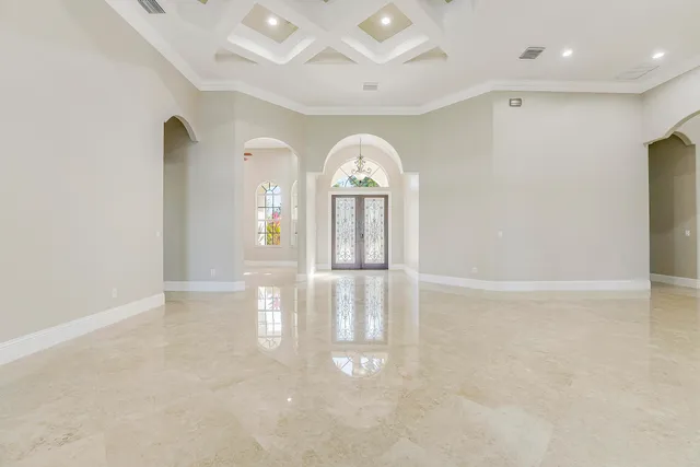 a kitchen with stainless steel appliances granite countertop a sink and a refrigerator