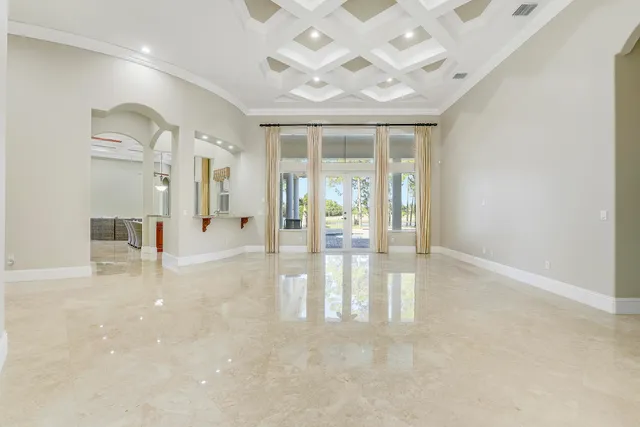 a kitchen with stainless steel appliances granite countertop a sink and a refrigerator