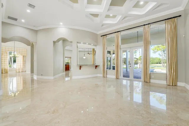 a bathroom with a granite countertop sink and a large mirror