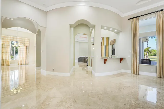 a bathroom with a granite countertop sink a large mirror and a shower
