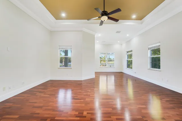 a bathroom with a granite countertop sink toilet mirror and shower