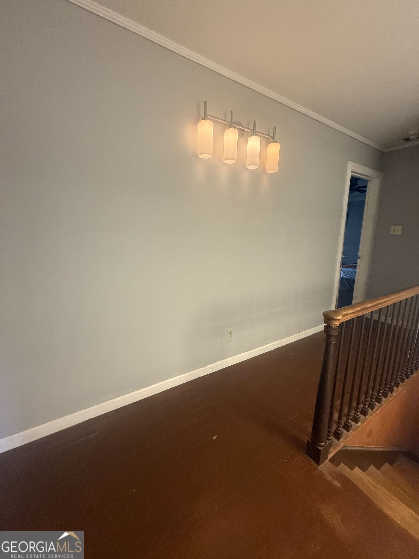 3861 Newnan Road Griffin, GA 30223 - Photo 48 of 89 an empty room with wooden floor and windows