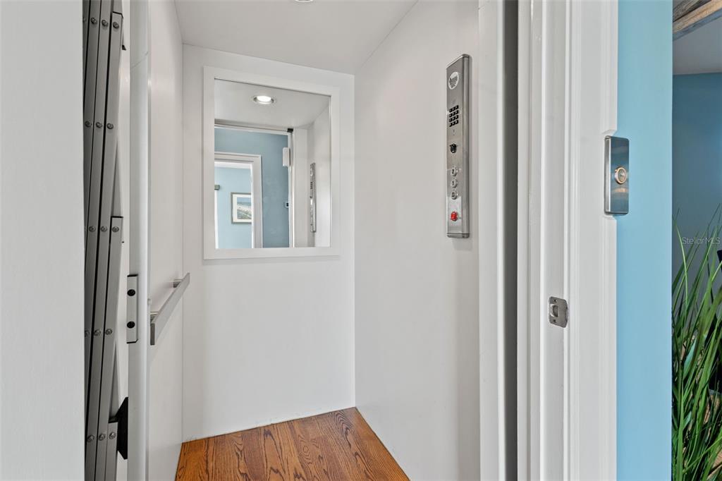 511 Windward Passage Clearwater Beach, FL 33767 - Photo 14 of 40 a view of a hallway with a elevator