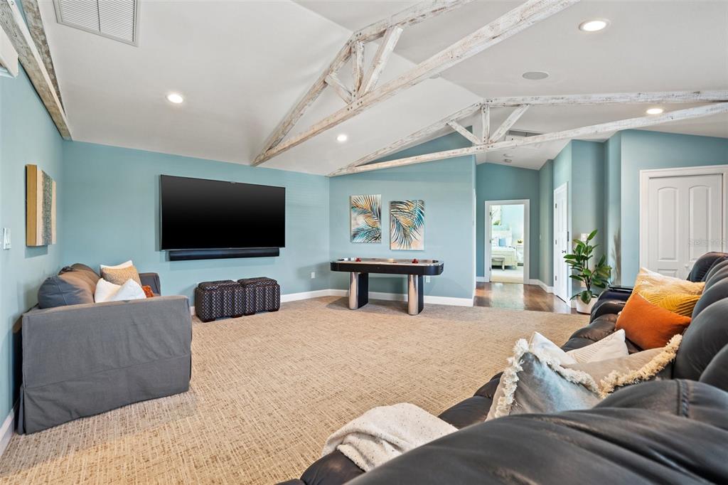511 Windward Passage Clearwater Beach, FL 33767 - Photo 29 of 40 a living room with furniture and a flat screen tv