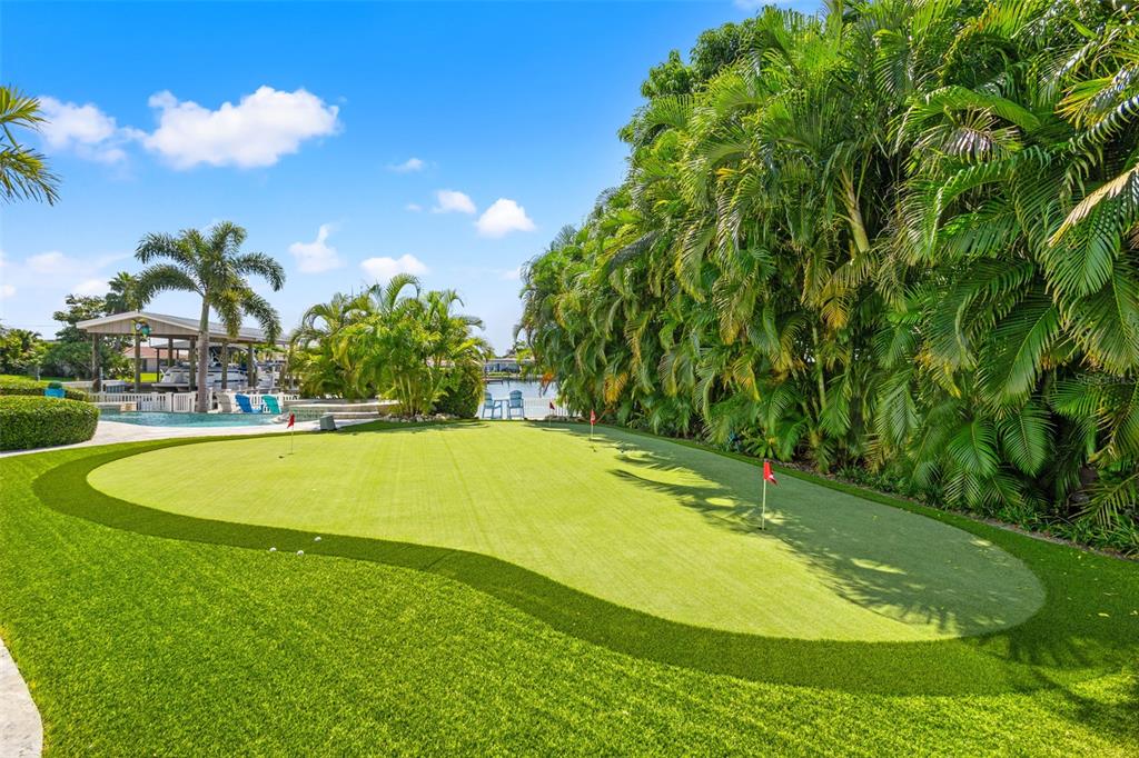 511 Windward Passage Clearwater Beach, FL 33767 - Photo 36 of 40 a view of a swimming pool with an outdoor space and seating area