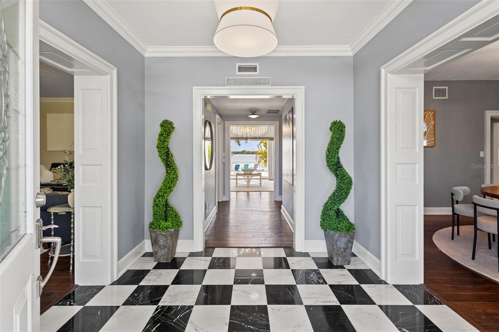 511 Windward Passage Clearwater Beach, FL 33767 - Photo 4 of 40 a view of a entryway door and a dining room