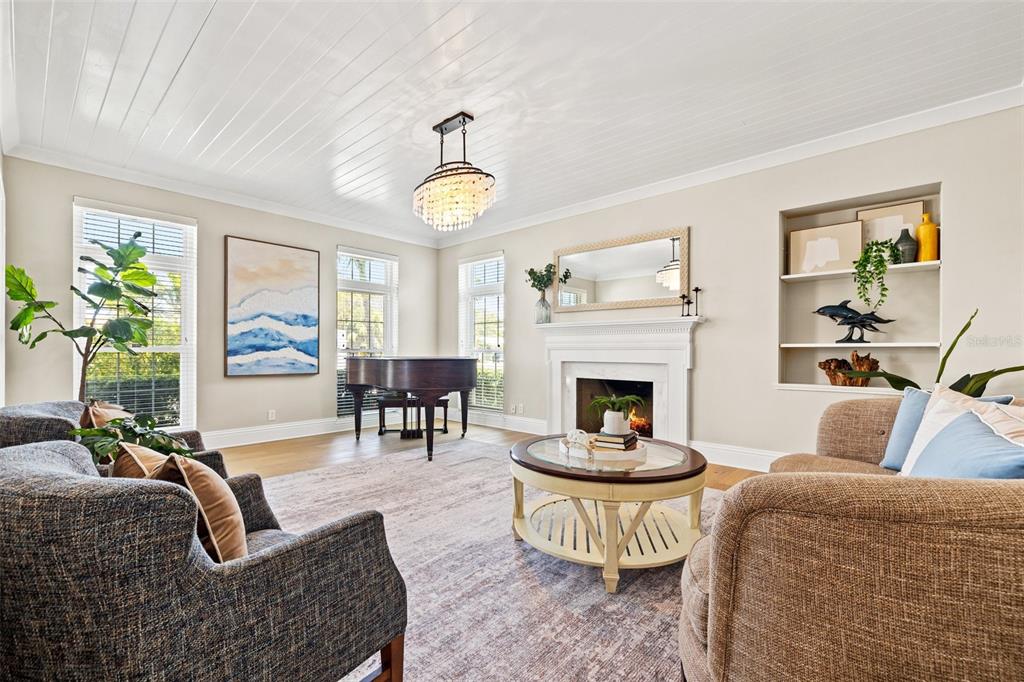 511 Windward Passage Clearwater Beach, FL 33767 - Photo 8 of 40 a living room with furniture fireplace and window