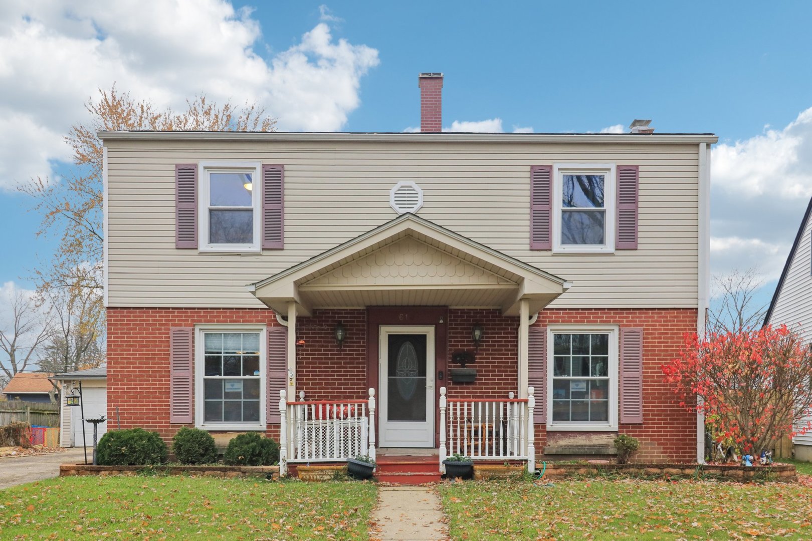 front view of a house with a yard
