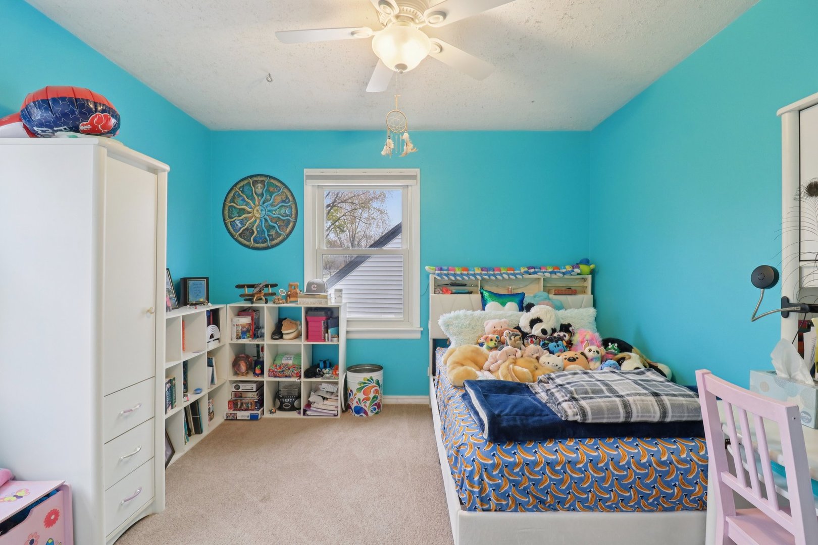 610 Maple Drive Buffalo Grove, IL 60089 - Photo 25 of 39 a bedroom with a bed and a bookshelf