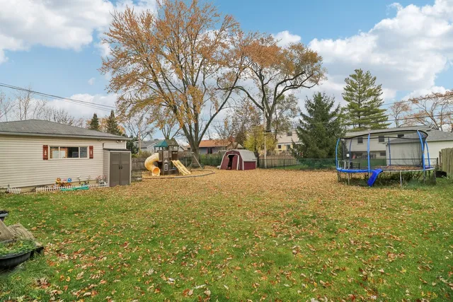 a backyard of a house with lots of green space