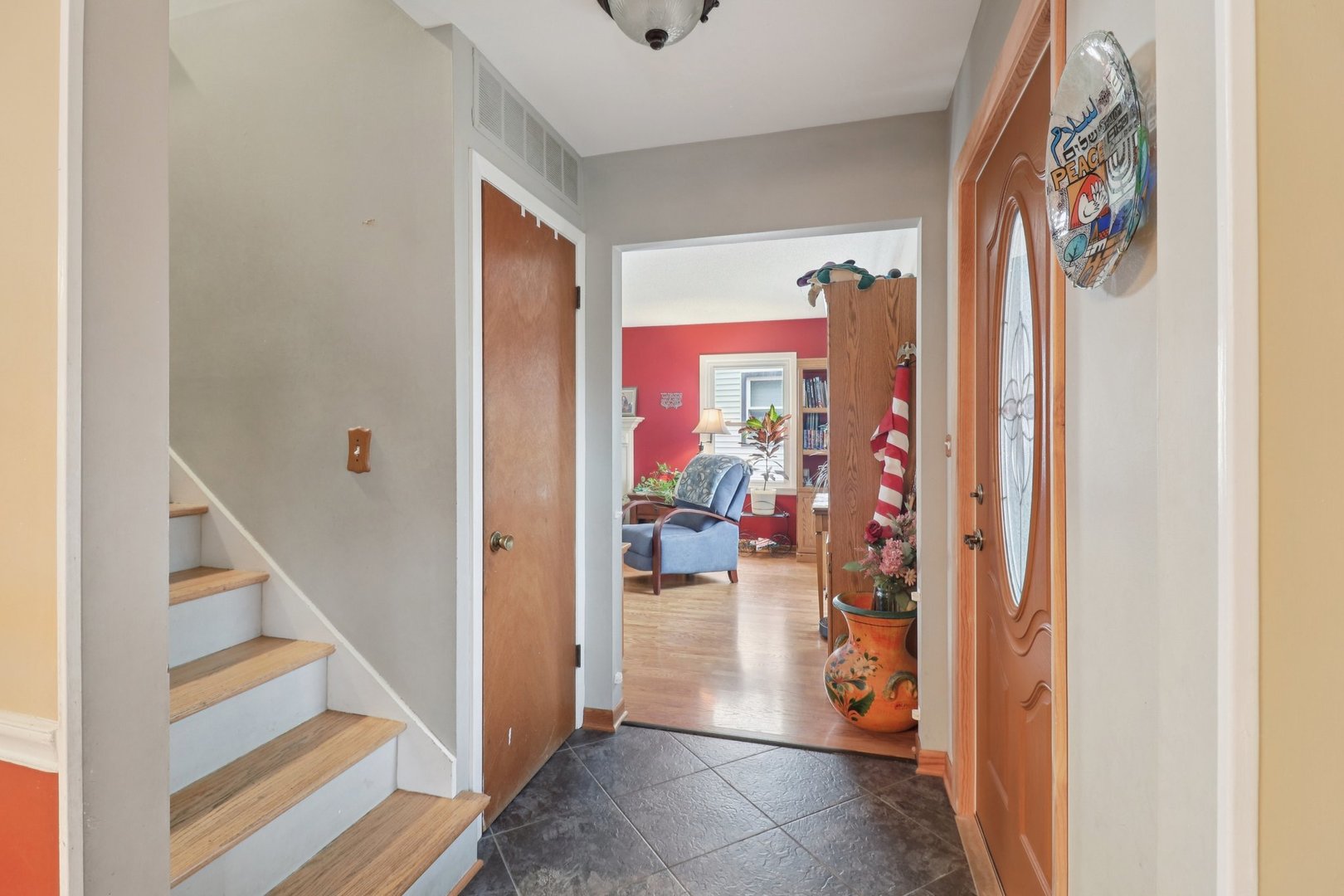 610 Maple Drive Buffalo Grove, IL 60089 - Photo 4 of 39 a view of a hallway with dining room and front door
