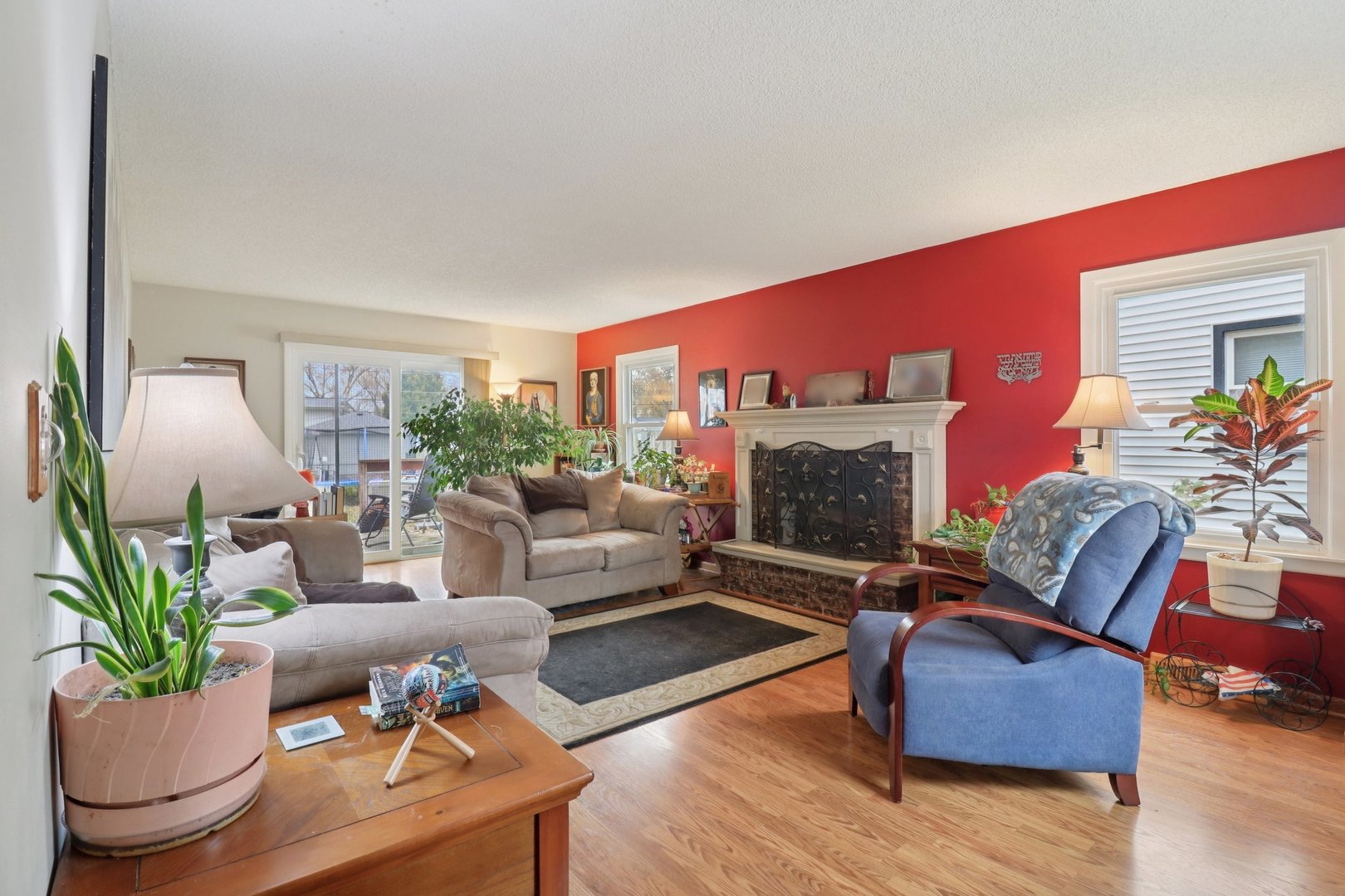 610 Maple Drive Buffalo Grove, IL 60089 - Photo 6 of 39 a living room with furniture and a fireplace