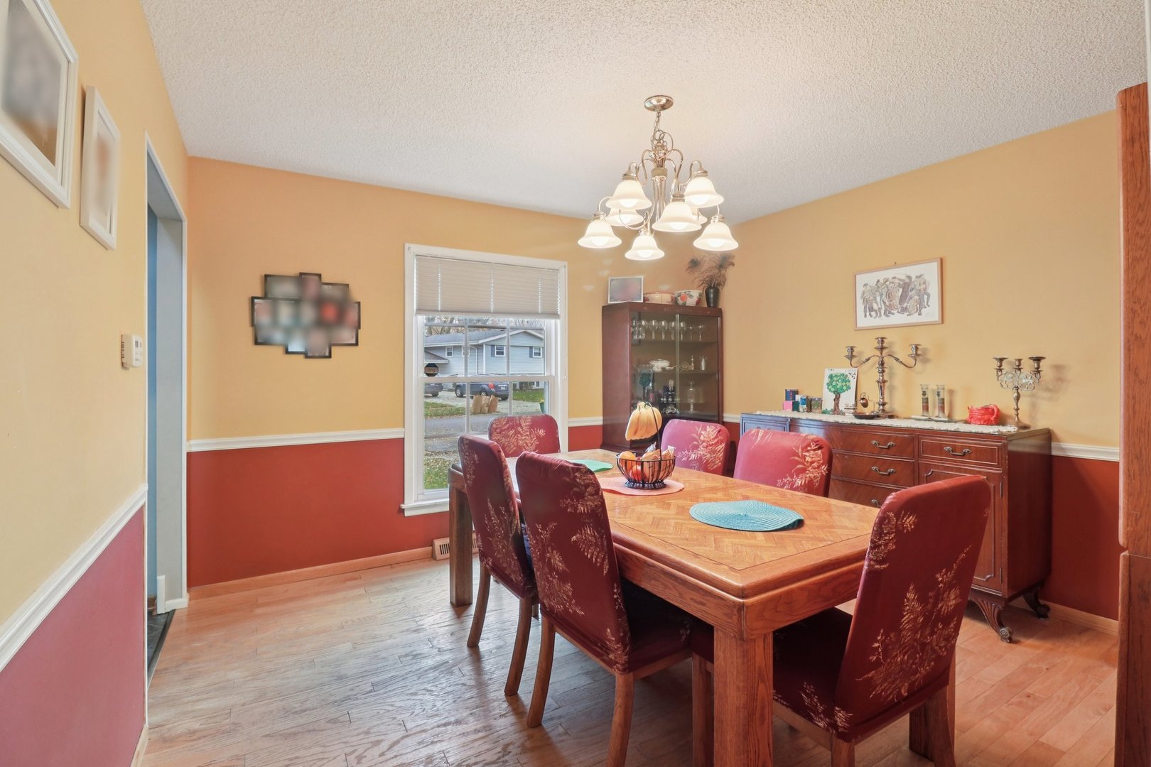 610 Maple Drive Buffalo Grove, IL 60089 - Photo 9 of 39 a view of a dining room with furniture window and wooden floor