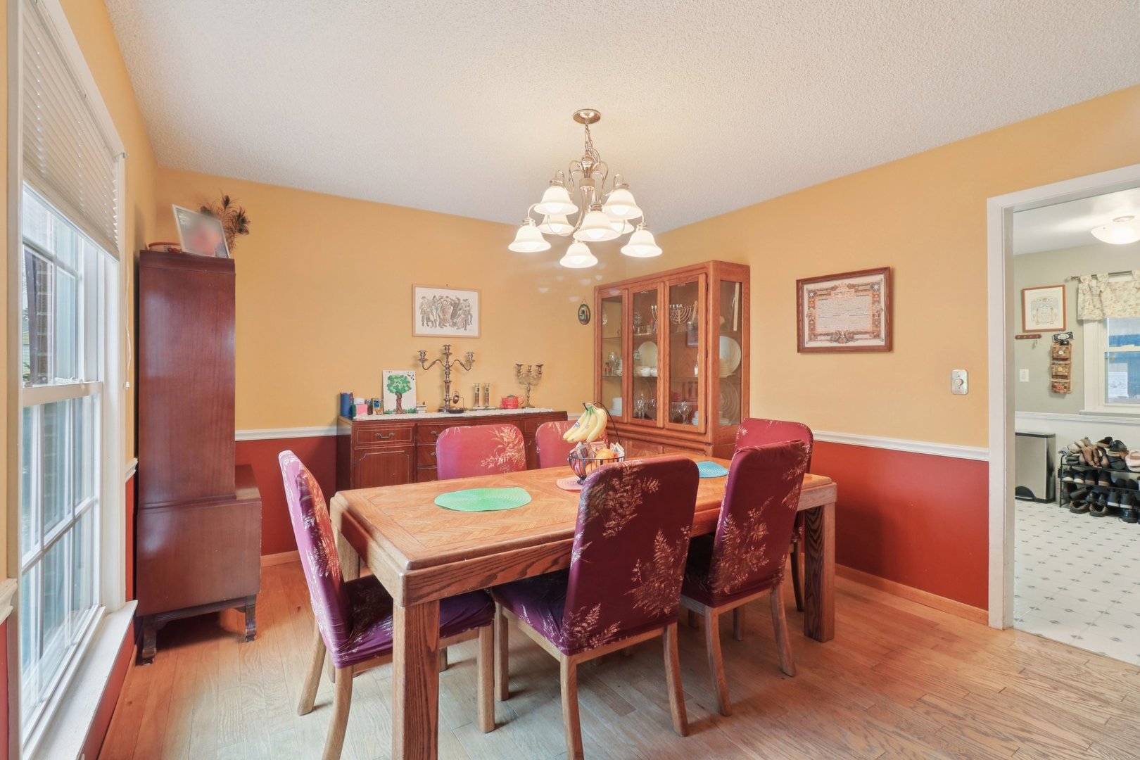 610 Maple Drive Buffalo Grove, IL 60089 - Photo 10 of 39 a view of a dining room with furniture and chandelier