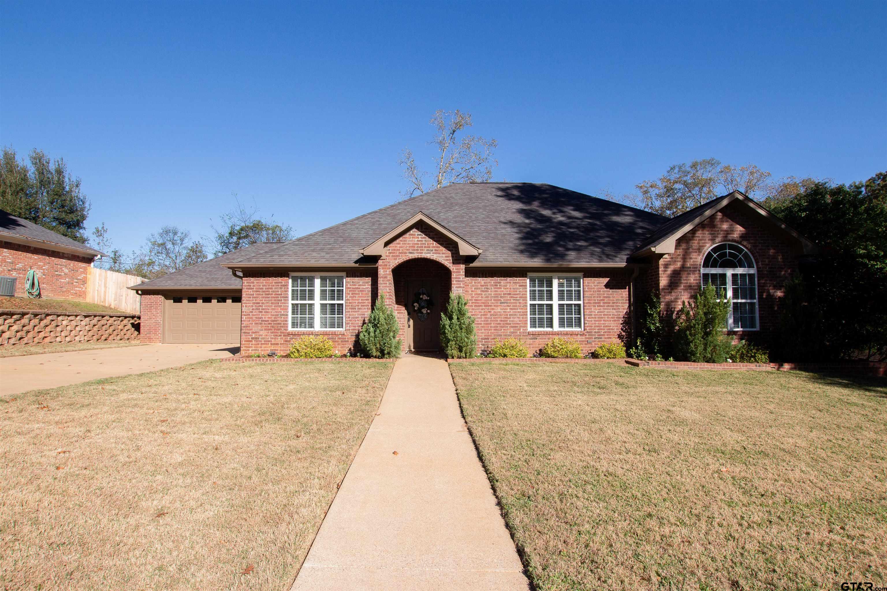 2618 Prestwick Road Jacksonville, TX 75766 - Photo 1 of 38 a front view of a house with a yard