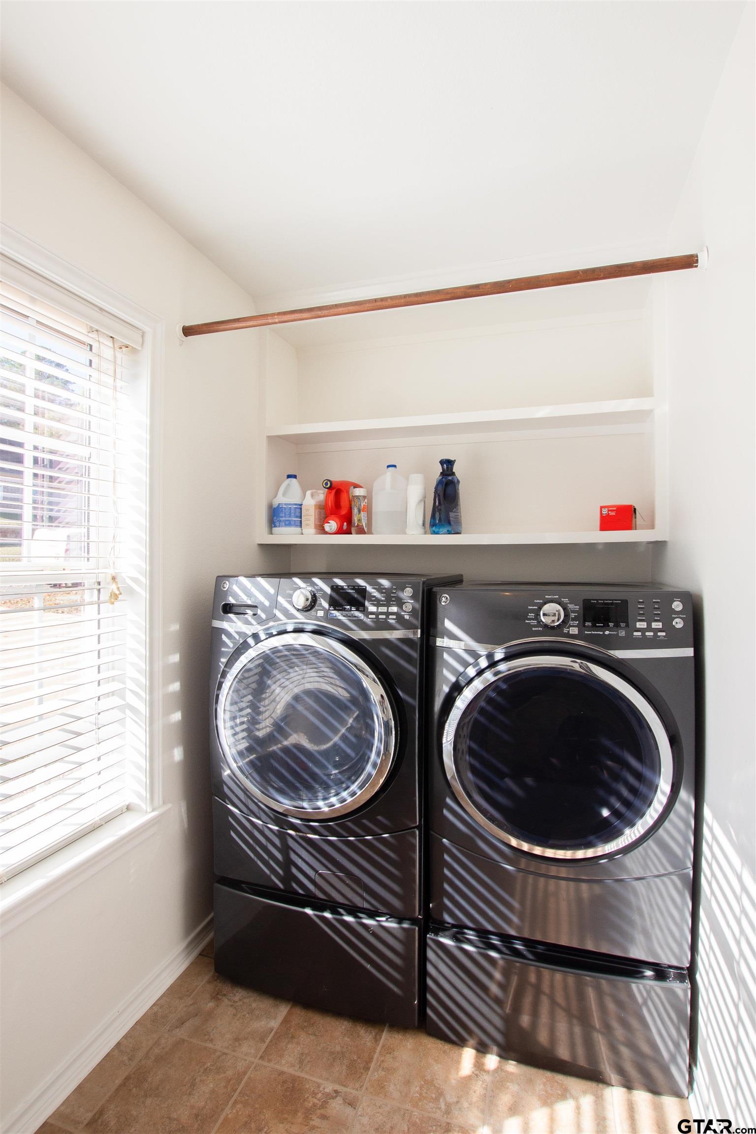 2618 Prestwick Road Jacksonville, TX 75766 - Photo 11 of 38 a view of washer and dryer with bathroom in it