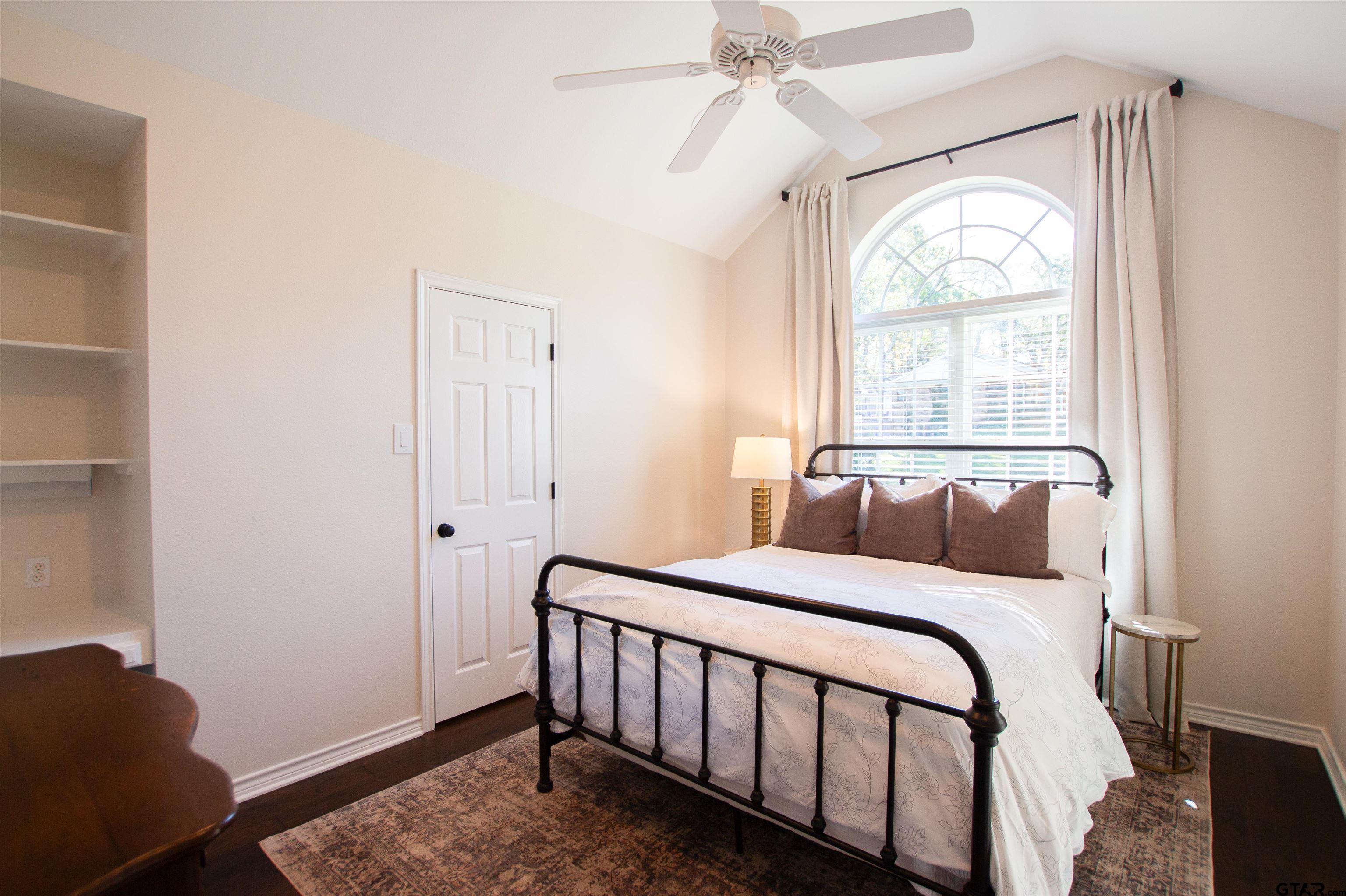 2618 Prestwick Road Jacksonville, TX 75766 - Photo 19 of 38 a bedroom with a bed and a window