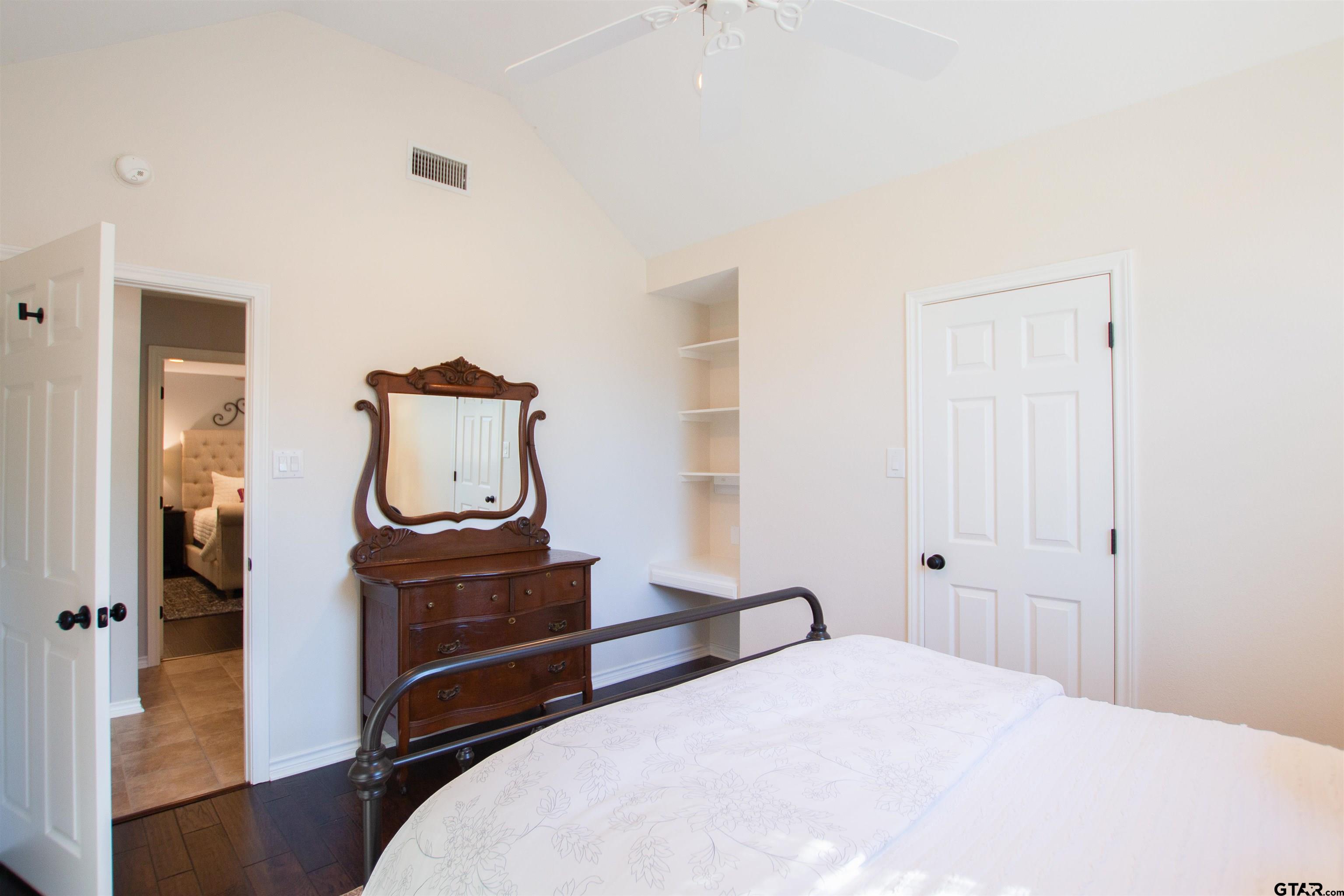 2618 Prestwick Road Jacksonville, TX 75766 - Photo 20 of 38 a bedroom with a bed and a dresser