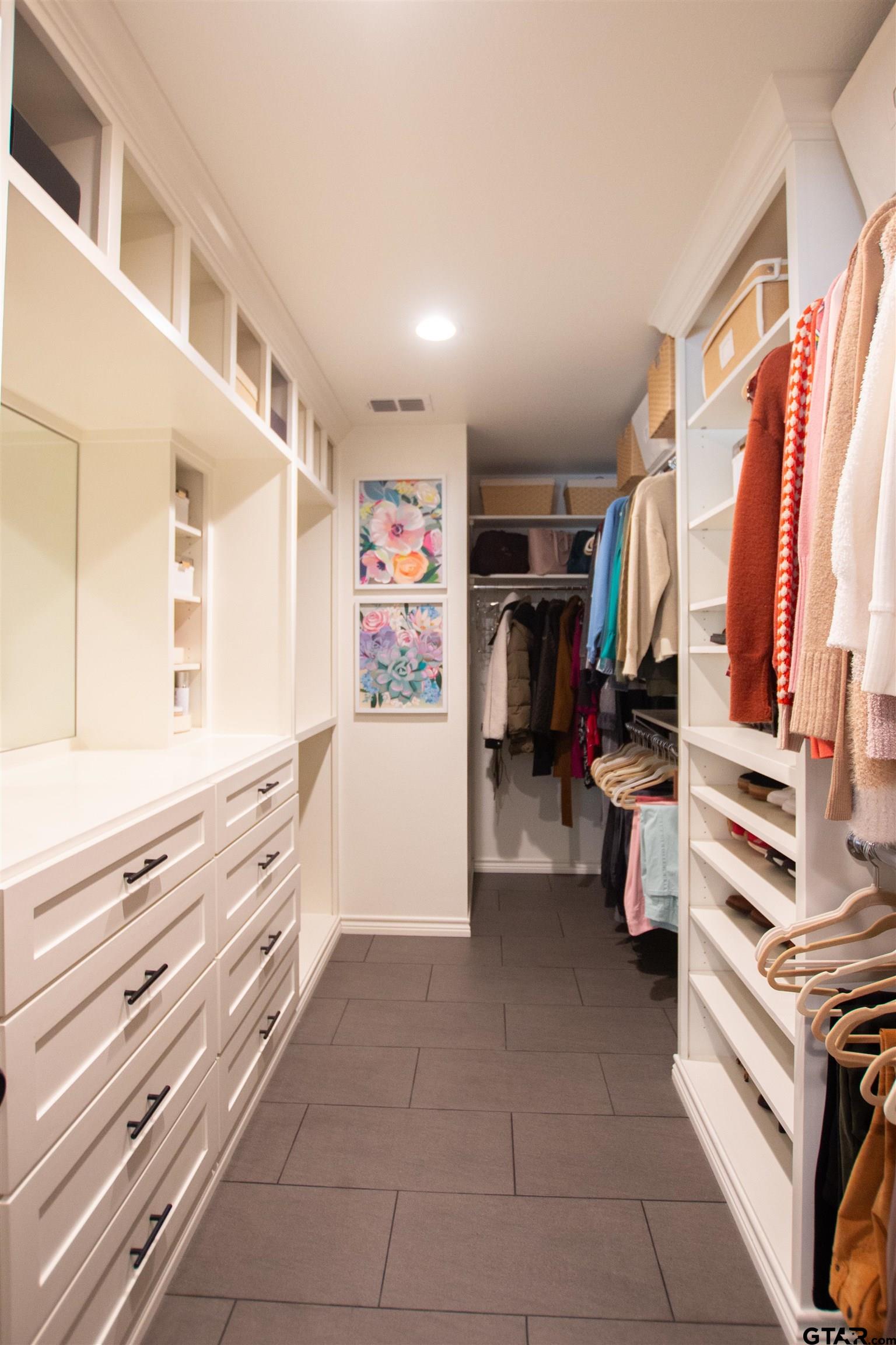 2618 Prestwick Road Jacksonville, TX 75766 - Photo 27 of 38 a view of walk in closet with clothes and shoes