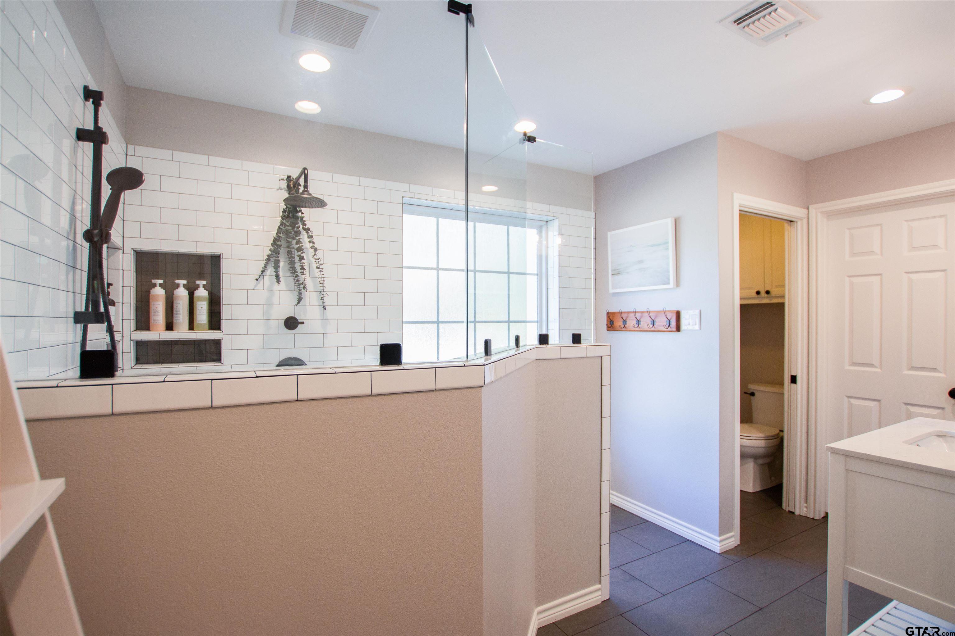 2618 Prestwick Road Jacksonville, TX 75766 - Photo 31 of 38 a kitchen with refrigerator and window