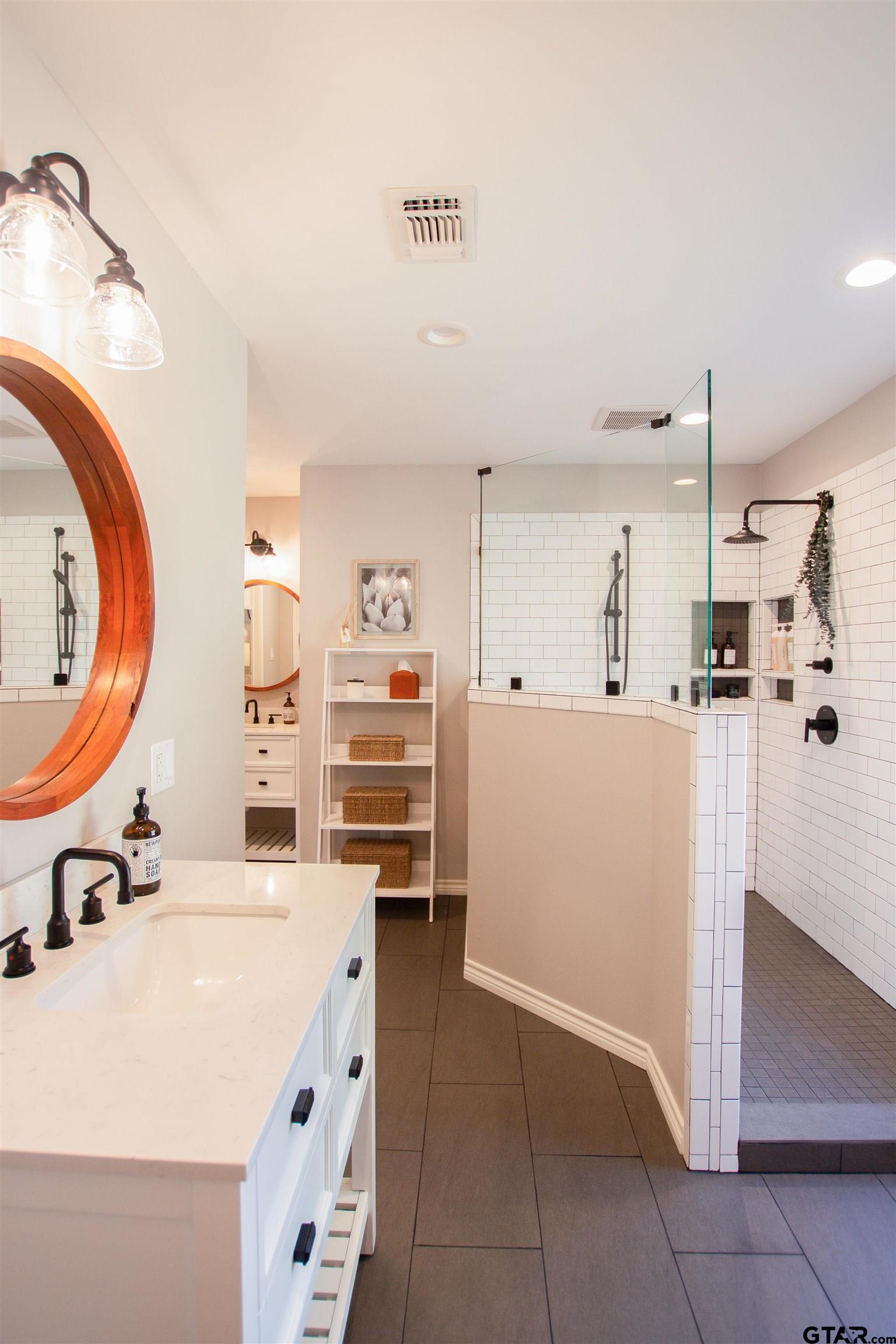 2618 Prestwick Road Jacksonville, TX 75766 - Photo 32 of 38 a kitchen with refrigerator and cabinets