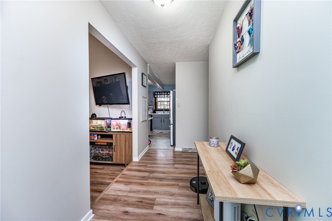 12190 Pinyon Lane Ruther Glen, VA 22546 - Photo 12 of 36 a room with furniture and wooden floor