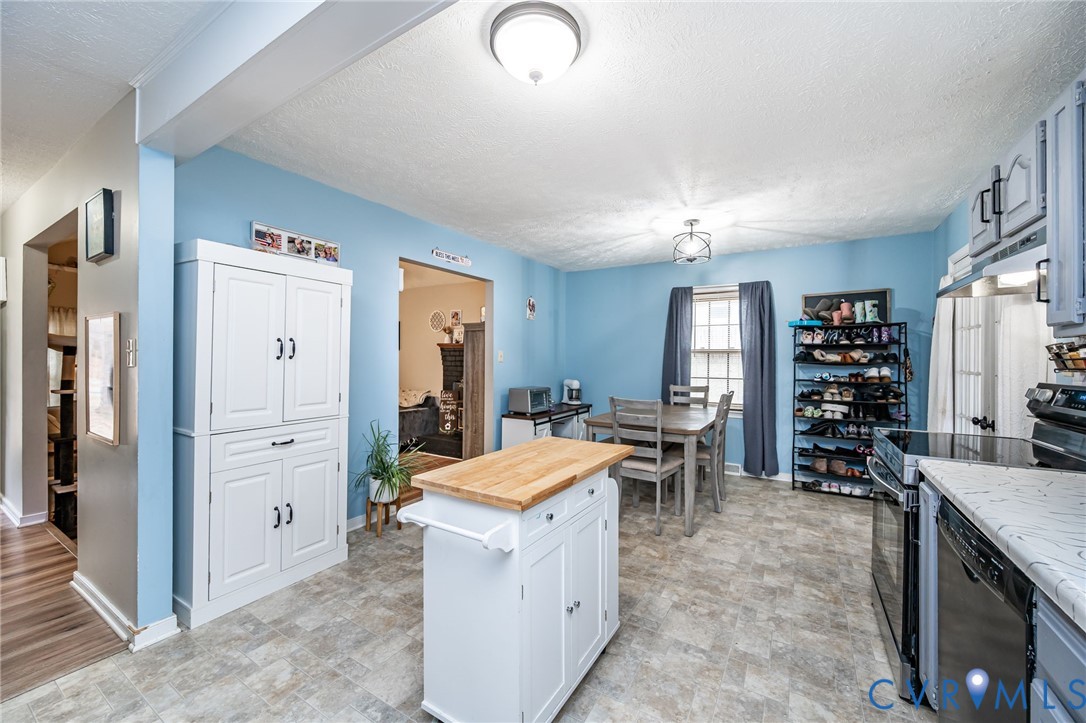 12190 Pinyon Lane Ruther Glen, VA 22546 - Photo 17 of 36 a kitchen with a refrigerator and countertop