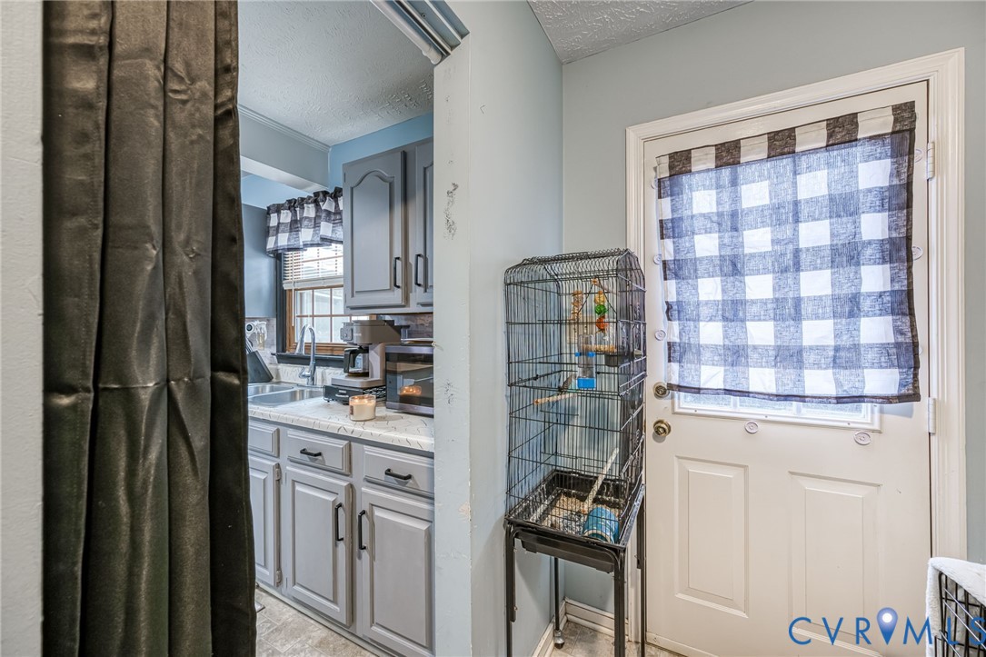 12190 Pinyon Lane Ruther Glen, VA 22546 - Photo 21 of 36 a kitchen with stainless steel appliances a refrigerator and cabinets