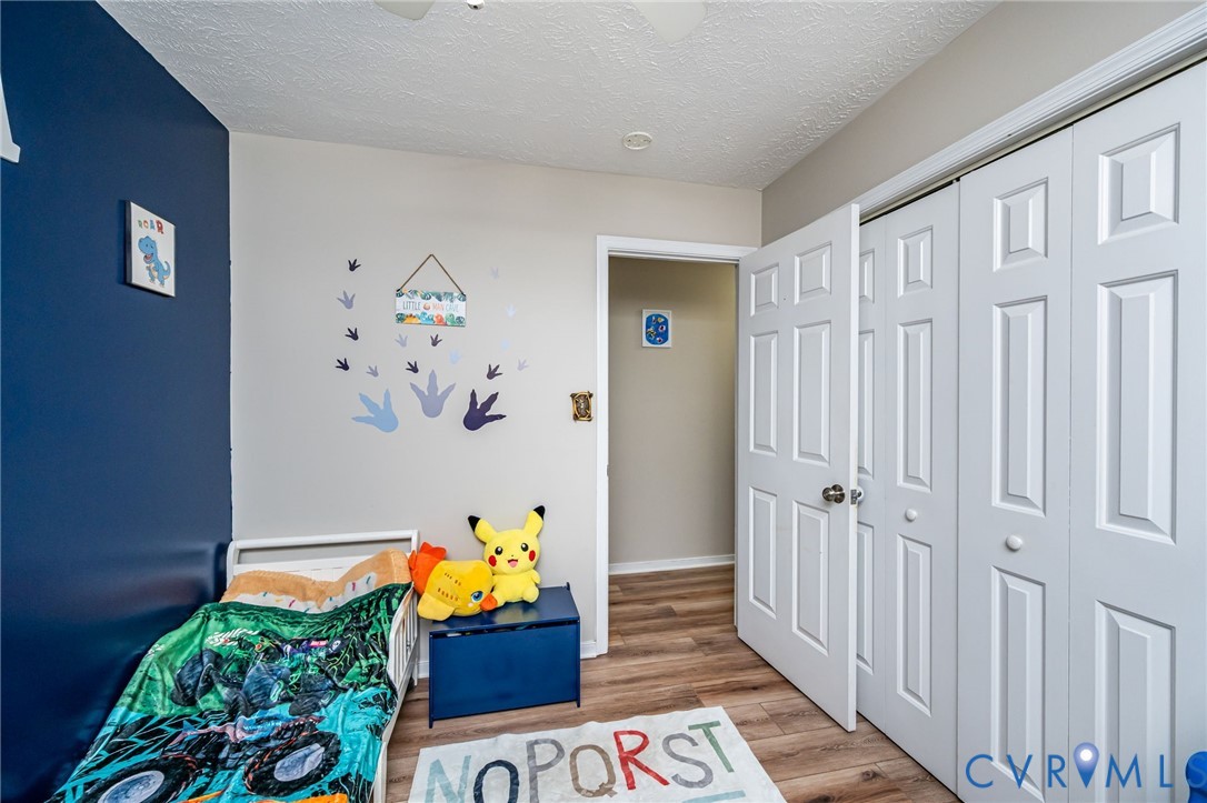 12190 Pinyon Lane Ruther Glen, VA 22546 - Photo 28 of 36 a very nice looking bedroom with a wooden floor