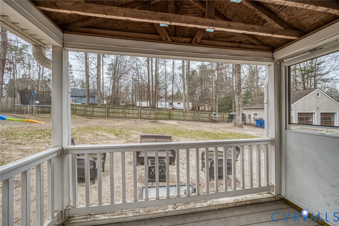 12190 Pinyon Lane Ruther Glen, VA 22546 - Photo 30 of 36 a view of a wooden balcony with a outdoor space