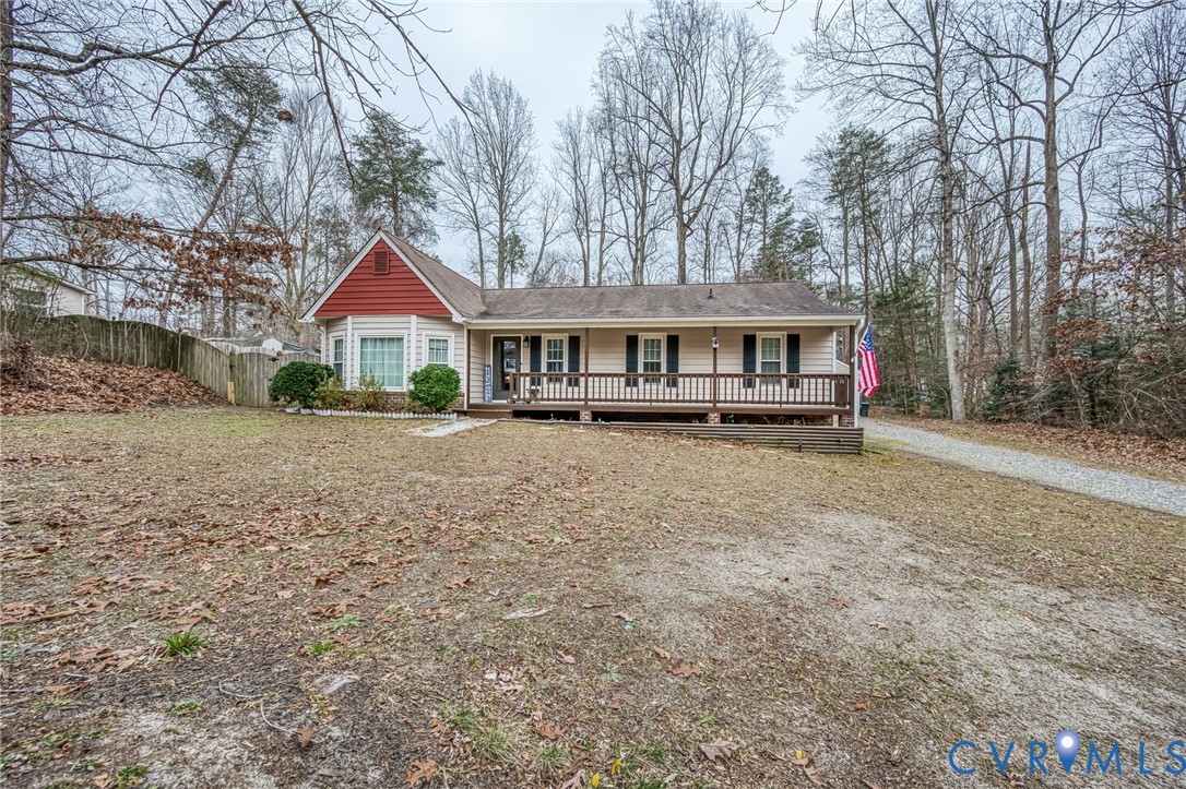 12190 Pinyon Lane Ruther Glen, VA 22546 - Photo 36 of 36 a front view of a house with a yard