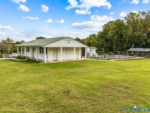 12190 Pinyon Lane Ruther Glen, VA 22546 - Photo 5 of 36 a view of a house with a big yard