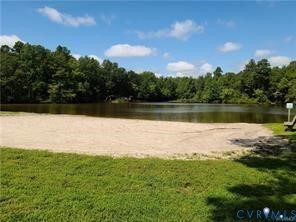 12190 Pinyon Lane Ruther Glen, VA 22546 - Photo 7 of 36 a view of a lake from a yard