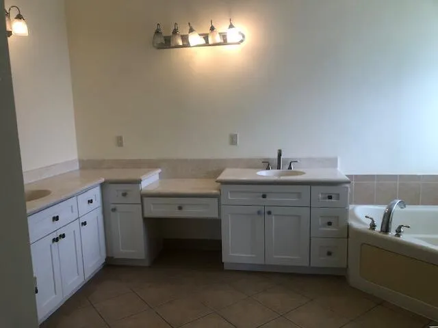 a utility room with cabinets