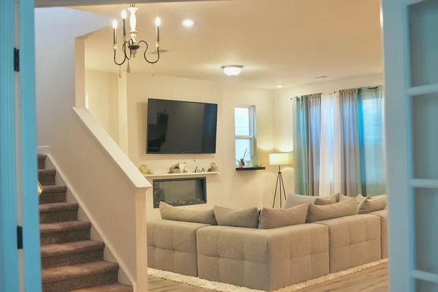 a living room with furniture and a flat screen tv